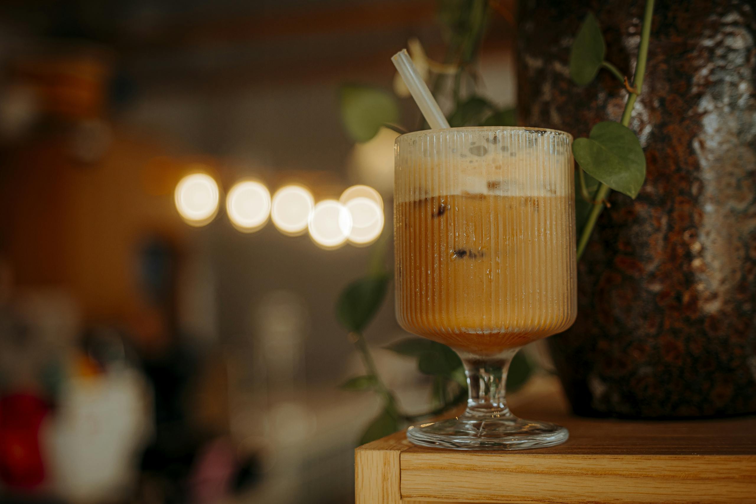 Close-up of a refreshing iced coffee in a stylish glass, perfect for summer.